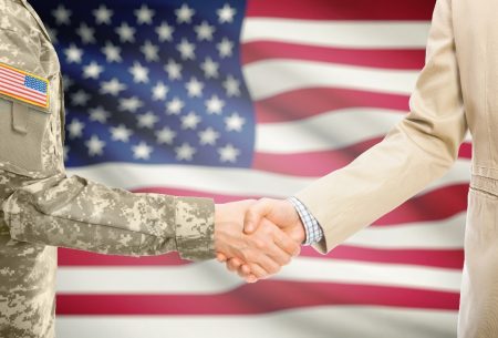 Handshake in front of flag